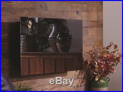 Touchstone 50 Mirror Onyx wall-mount electric fireplace. Heat & simulated flame