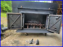 Wood burning fireplace insert with blower fan